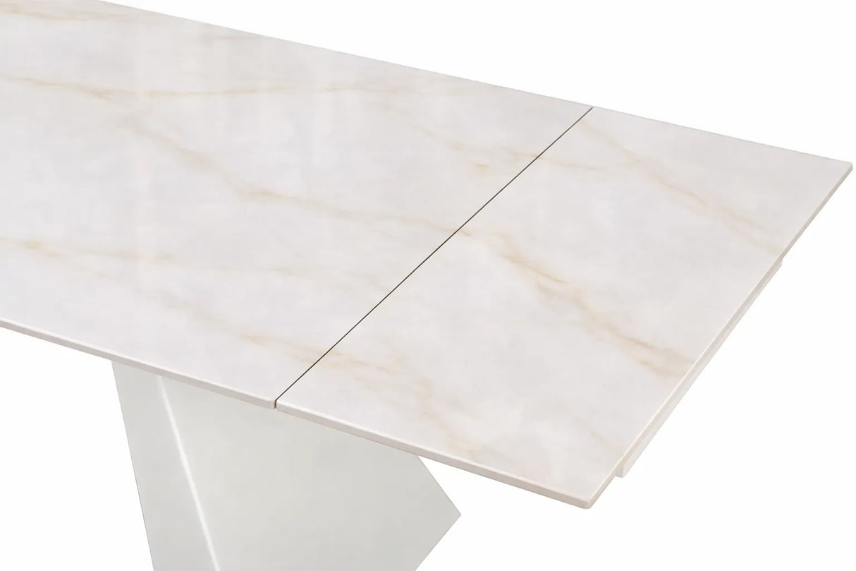 Tavolo Alex allungabile con top in gres porcellanato effetto marmo Calacatta e gambe in metallo bianco