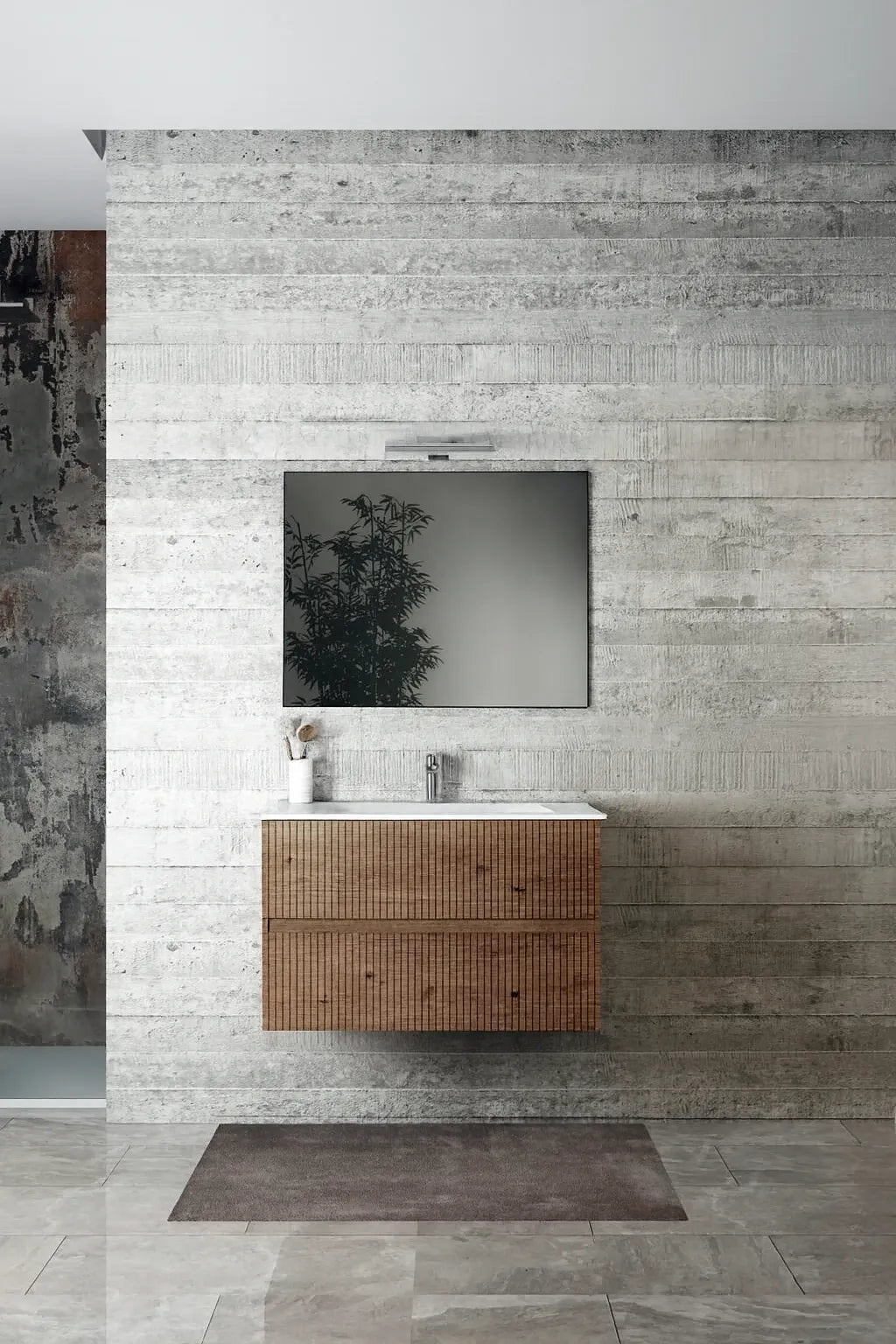 Composizione bagno sospesa modello Brigitte con lavabo in ceramica, base con cassetti effetto millerighe, colonna e specchio filo lucido.