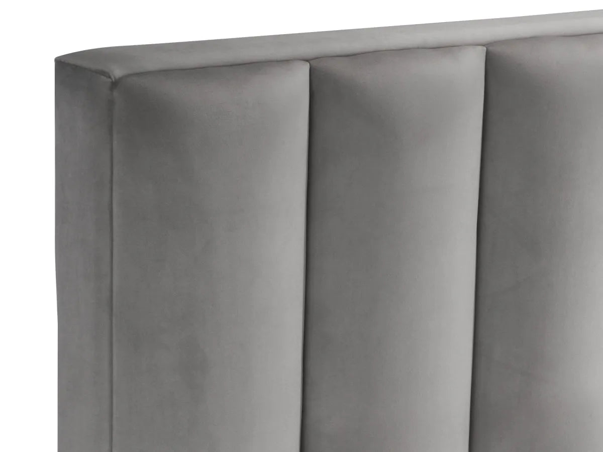 Letto imbottito Parigi con contenitore, testiera a fasce verticali e piedini alti