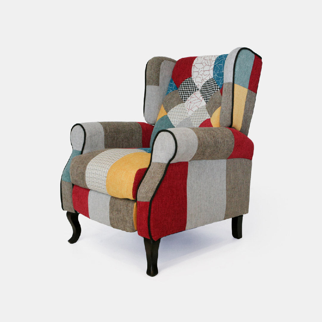 Poltrona reclinabile patchwork in tessuto policotone colorato con poggiapiedi, schienale comfort e struttura in legno robusta