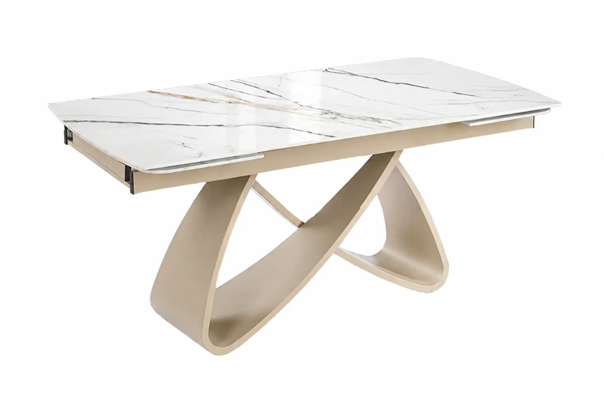 Tavolo allungabile Eros con piano in ceramica effetto marmo oro lucido e struttura in metallo color Champagne da 180 a 260 cm.