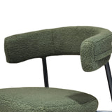 Poltrona Megan in tessuto bouclé con gambe in metallo nero, stile moderno e avvolgente, disponibile in verde o corda
