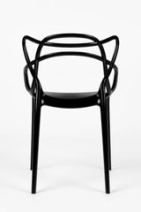 Sedia Curve in polipropilene nero lucido con design moderno e linee intrecciate