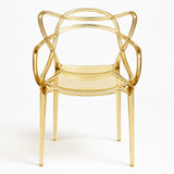 Sedia Curve in polipropilene trasparente color oro con design moderno e linee intrecciate

