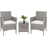 Set da giardino in rattan grigio con due poltrone e tavolino in vetro temperato con cuscini beige