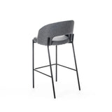 Sgabello Greta in tessuto grigio con schienale imbottito e gambe in metallo nero, ideale per penisola e cucina moderna