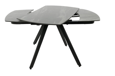 Tavolo allungabile rotante in ceramica effetto marmo nero con gambe in metallo, da 6 a 8 posti.