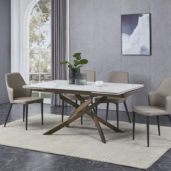 Tavolo Pegaso allungabile in ceramica con gambe incrociate in metallo, design elegante per soggiorno o cucina

