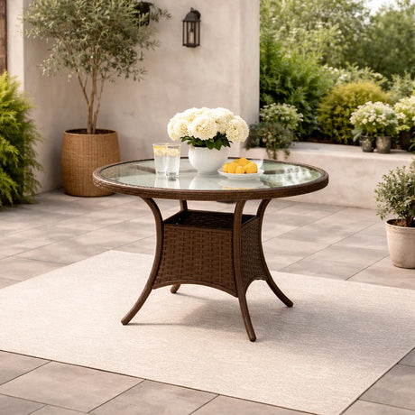 Tavolo Lory rotondo Ø80 cm in rattan intrecciato con piano in vetro temperato per giardino e terrazzo
