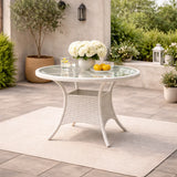 Tavolo Lory rotondo Ø80 cm in rattan intrecciato con piano in vetro temperato per giardino e terrazzo