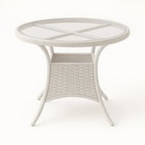 Tavolo Lory rotondo Ø80 cm in rattan intrecciato con piano in vetro temperato per giardino e terrazzo
